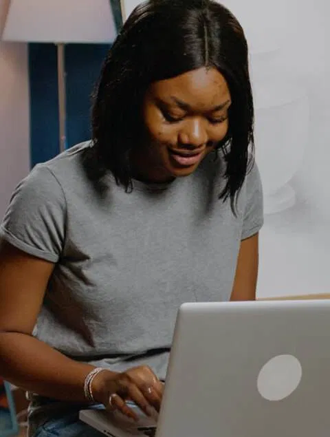 a young woman using a laptop, featured in a listicle format article.