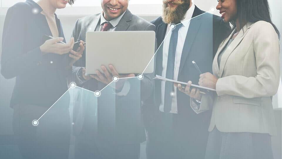 A group of business people looking at a graph, analyzing page tweaks that increase conversions.